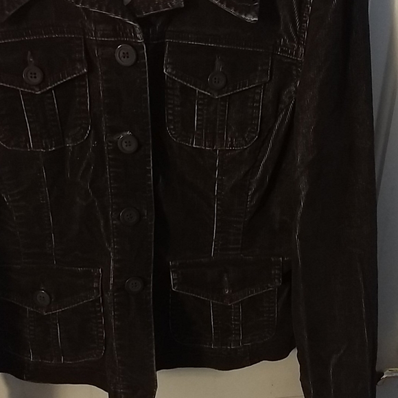 Black denim jacket with white running through it. - Picture 2 of 4